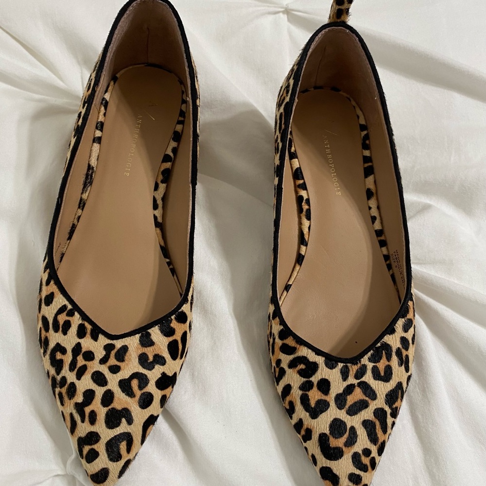 By Anthropologie Calf hair, wood block heels from Anthropologie.